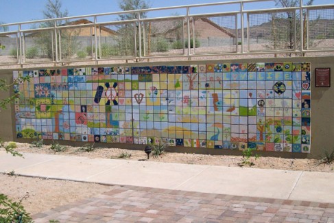 Full view of a 5x25 foot painted tile mural in a desert-friendly hospital courtyard