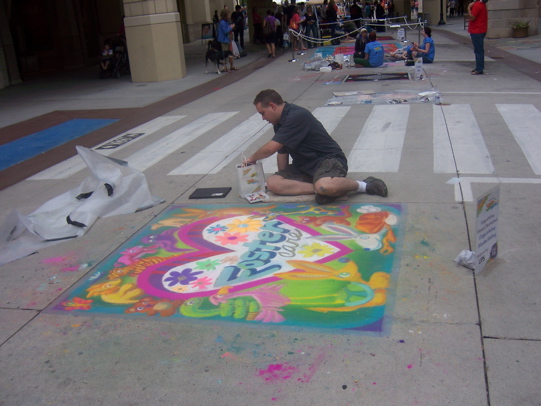 Roger working on a chalk mural