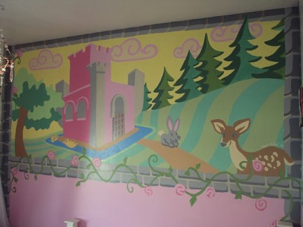 A pink castle on a hill near a forest