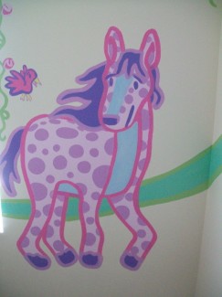 Pink polka dot horse with a purple mane