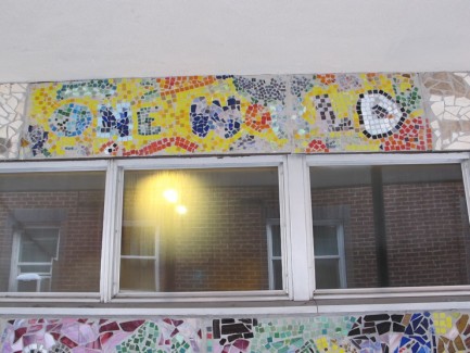 Words "One World" written in mosaic